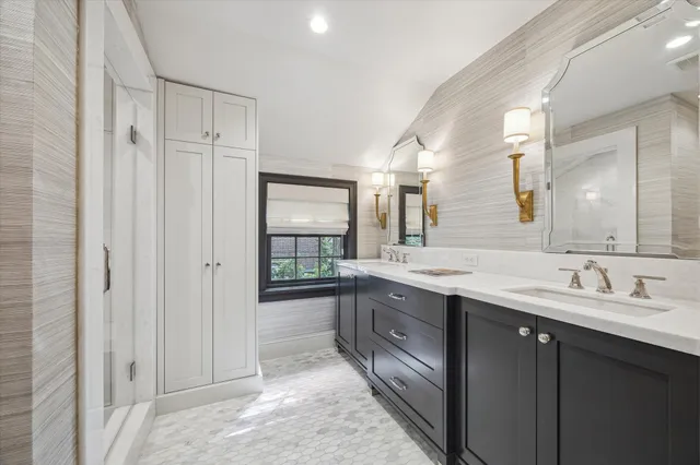 a bathroom with a granite countertop sink mirror and