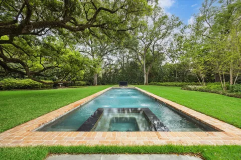a view of a yard with swimming pool