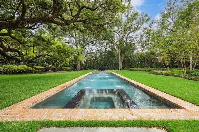 a view of a yard with swimming pool
