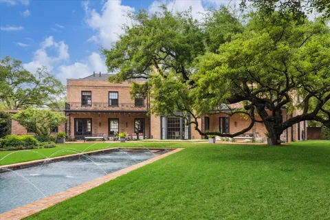 a house view with a sitting space garden view