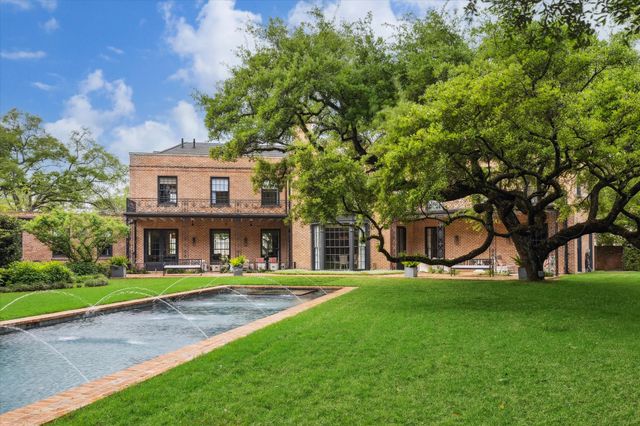 a house view with a sitting space garden view