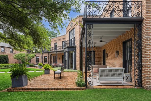 a view of an house with backyard porch and sitting area