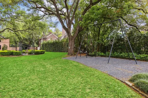 a view of a park with large trees