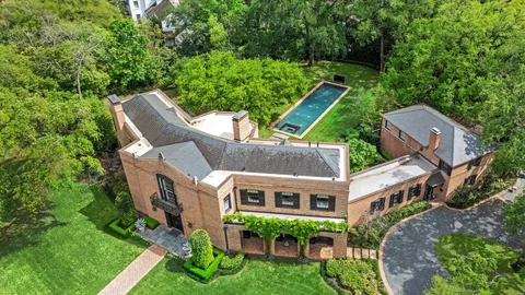 aerial view of a house with a yard table and chairs