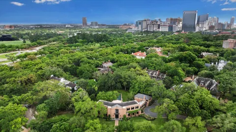 a view of a garden with a building in the background