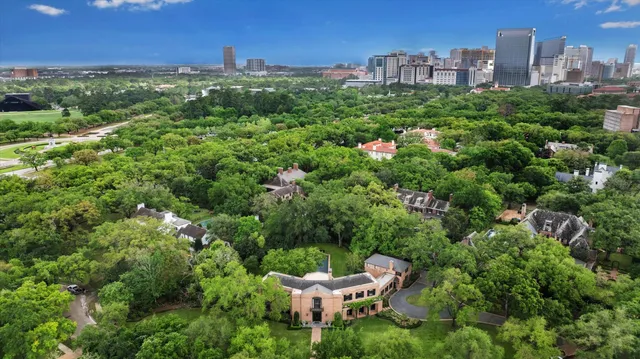 a view of a garden with a building in the background