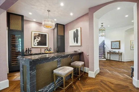 a large kitchen with a table and chairs in it