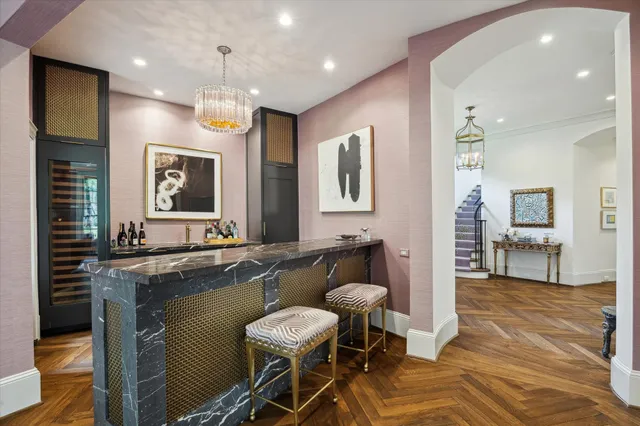 a large kitchen with a table and chairs in it