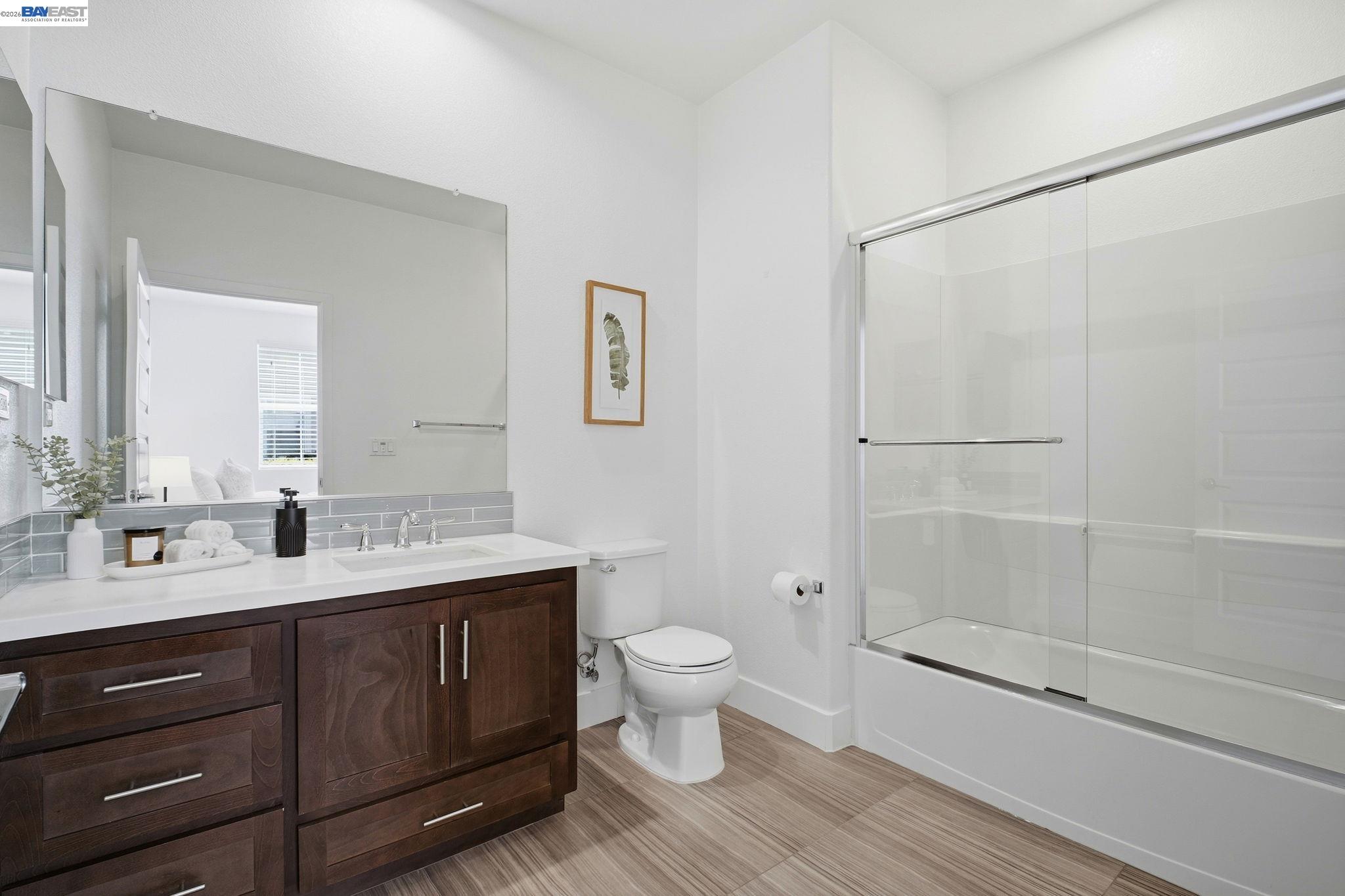37784 Taro Terrace Newark, CA 94560 - Photo 11 of 20 a bathroom with a double vanity sink toilet and shower
