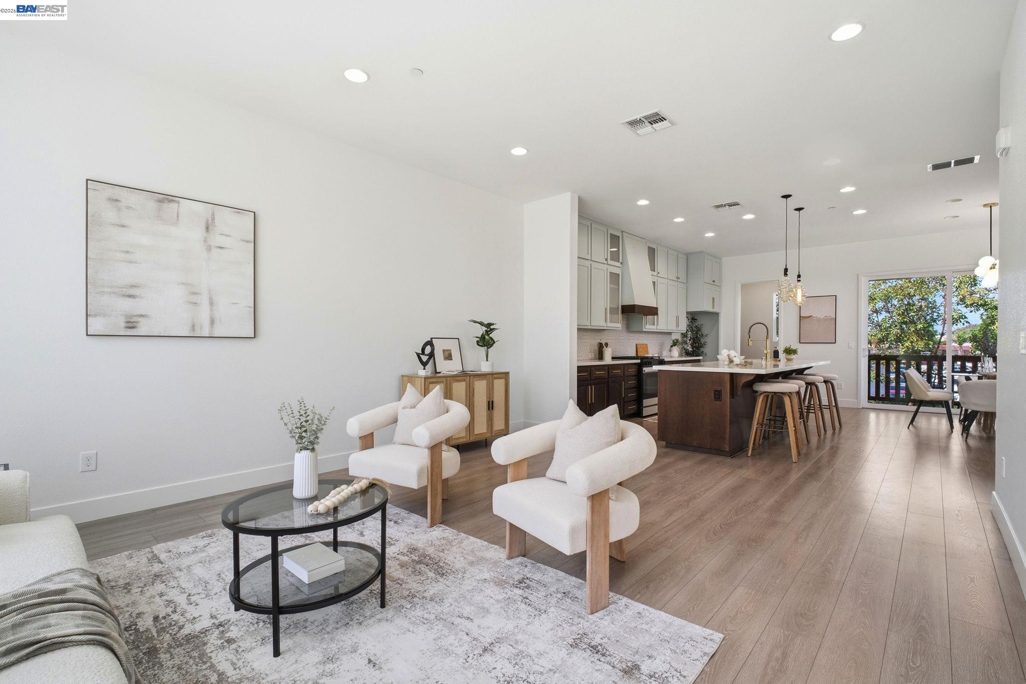 37784 Taro Terrace Newark, CA 94560 - Photo 5 of 20 a living room with furniture kitchen view and a wooden floor
