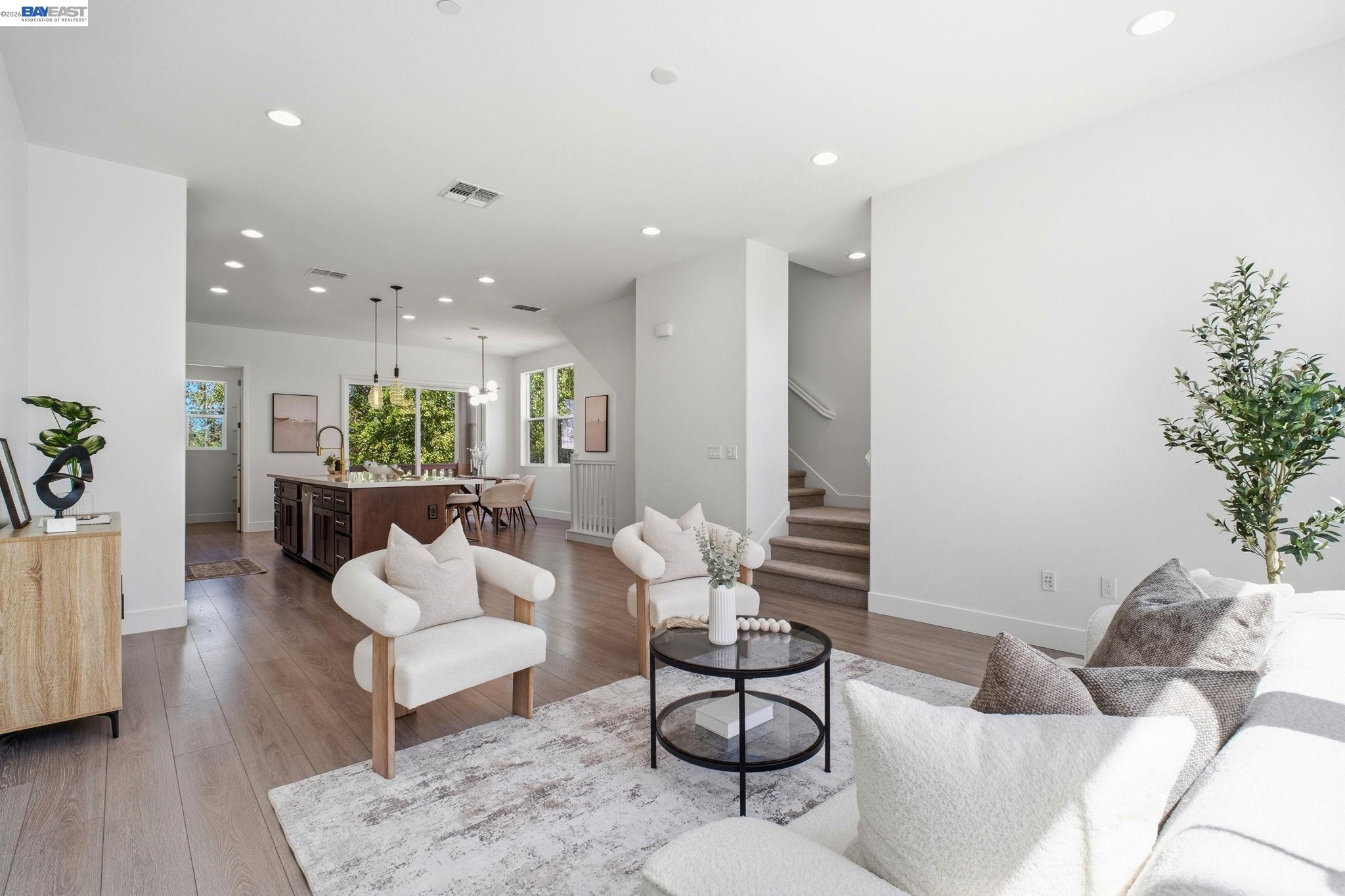 37784 Taro Terrace Newark, CA 94560 - Photo 6 of 20 a living room with furniture and a potted plant