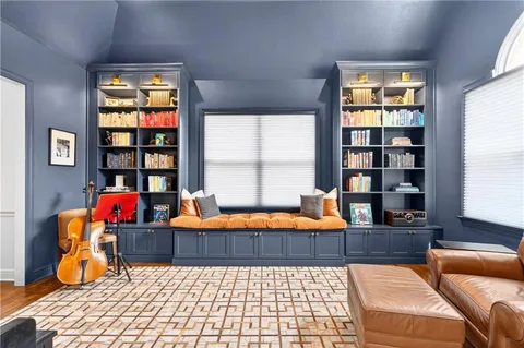 a bedroom with furniture and a window