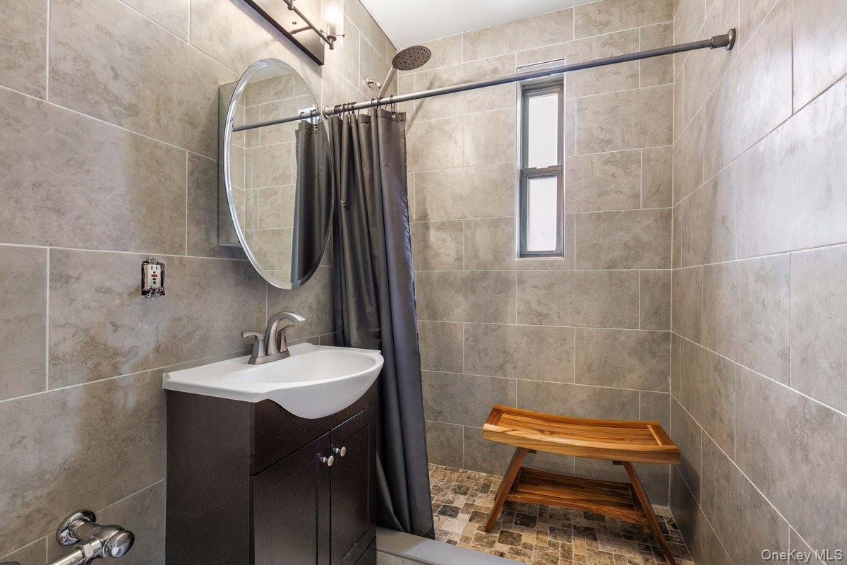 2 Overlook Road, Unit 1B7A White Plains, NY 10605 - Photo 9 of 18 a bathroom with a sink and a mirror