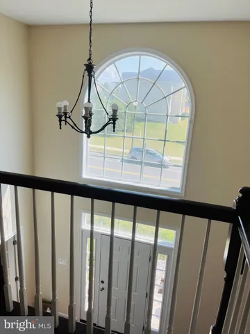 a view of an entryway with a wooden floor
