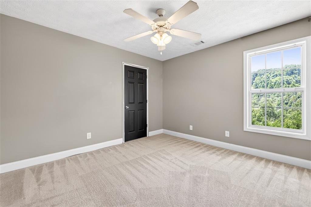 89 Katie Spring Lane Jefferson, GA 30549 - Photo 28 of 63 a view of an empty room with a window