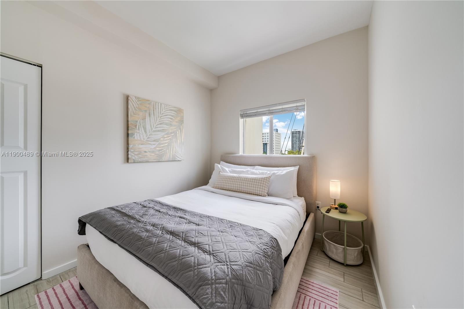 481 Northeast 29th Street, Unit 601 Miami, FL 33137 - Photo 17 of 23 a bedroom with a bed and window