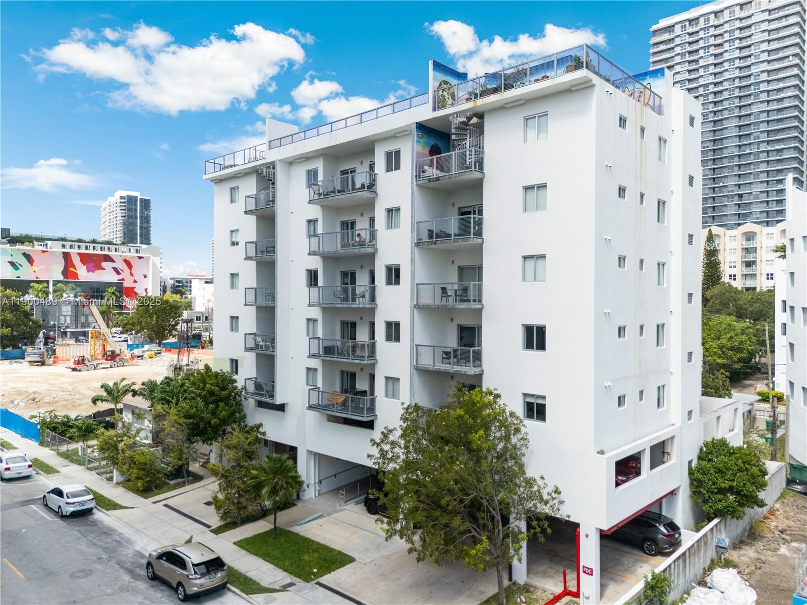 481 Northeast 29th Street, Unit 601 Miami, FL 33137 - Photo 21 of 23 a view of a building with yard and potted plants