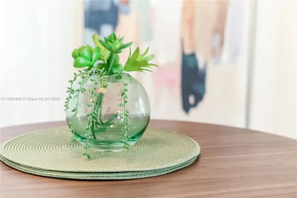 a vase of flowers sitting on a table