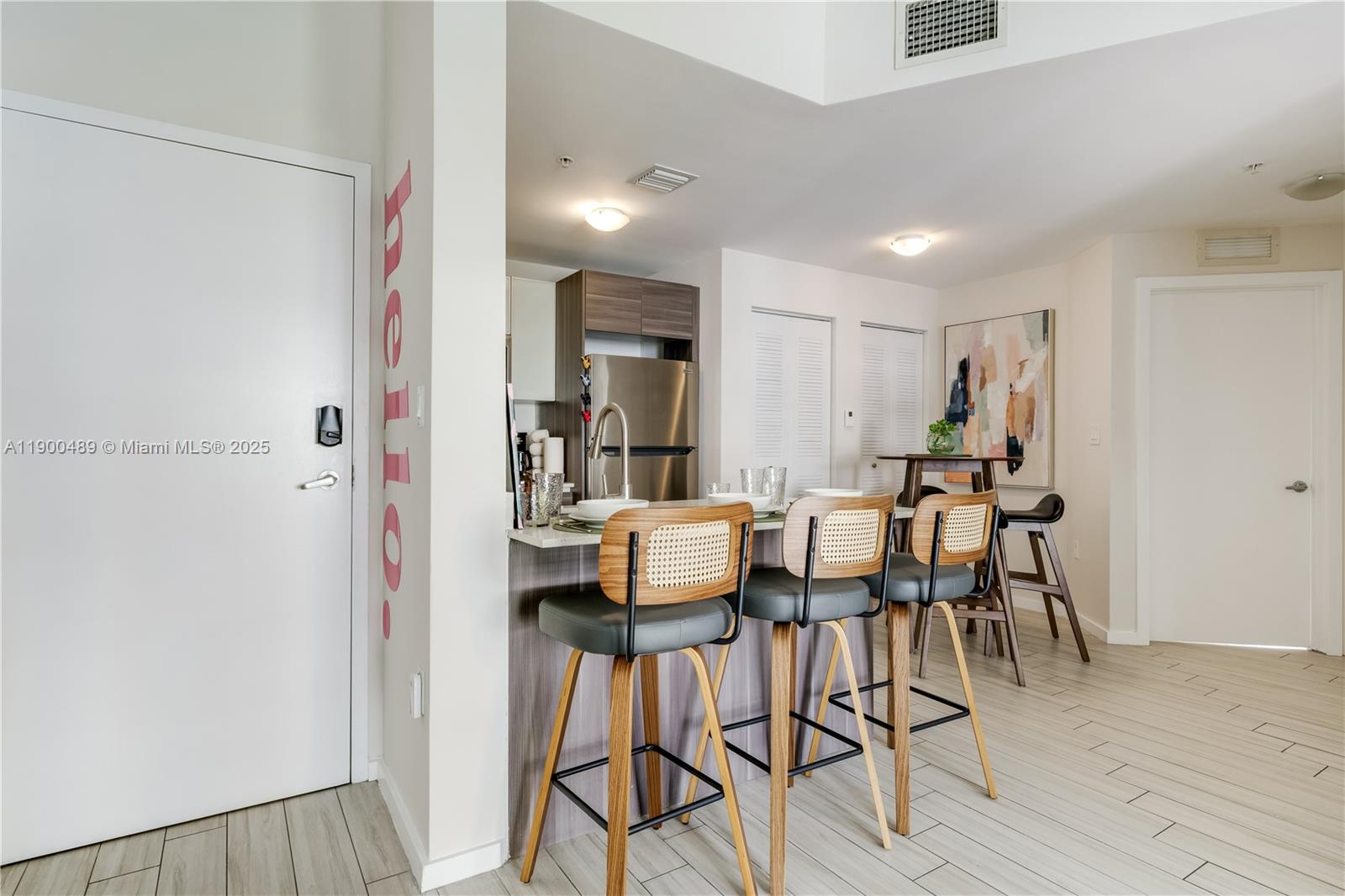 481 Northeast 29th Street, Unit 601 Miami, FL 33137 - Photo 10 of 23 a dining room with furniture and wooden floor