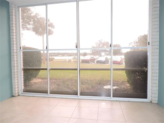 a view of hallway with wooden floor
