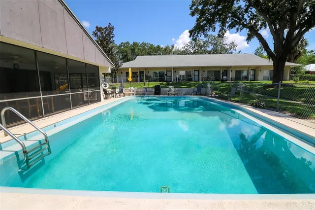 a dining room with furniture and a garden view