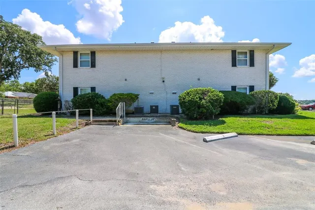 a view of a yard with an outdoor seating