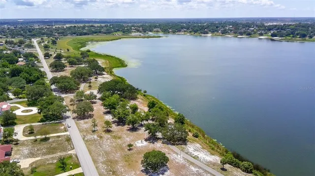 an aerial view of house with yard swimming pool and outdoor seating