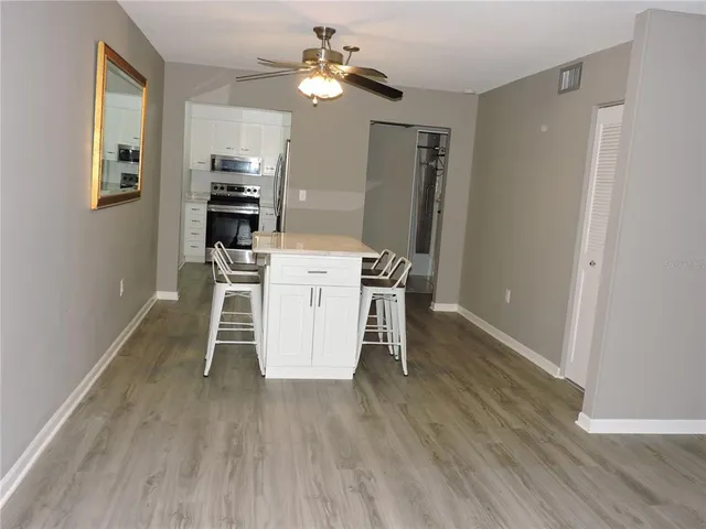 a kitchen with a refrigerator stove and sink