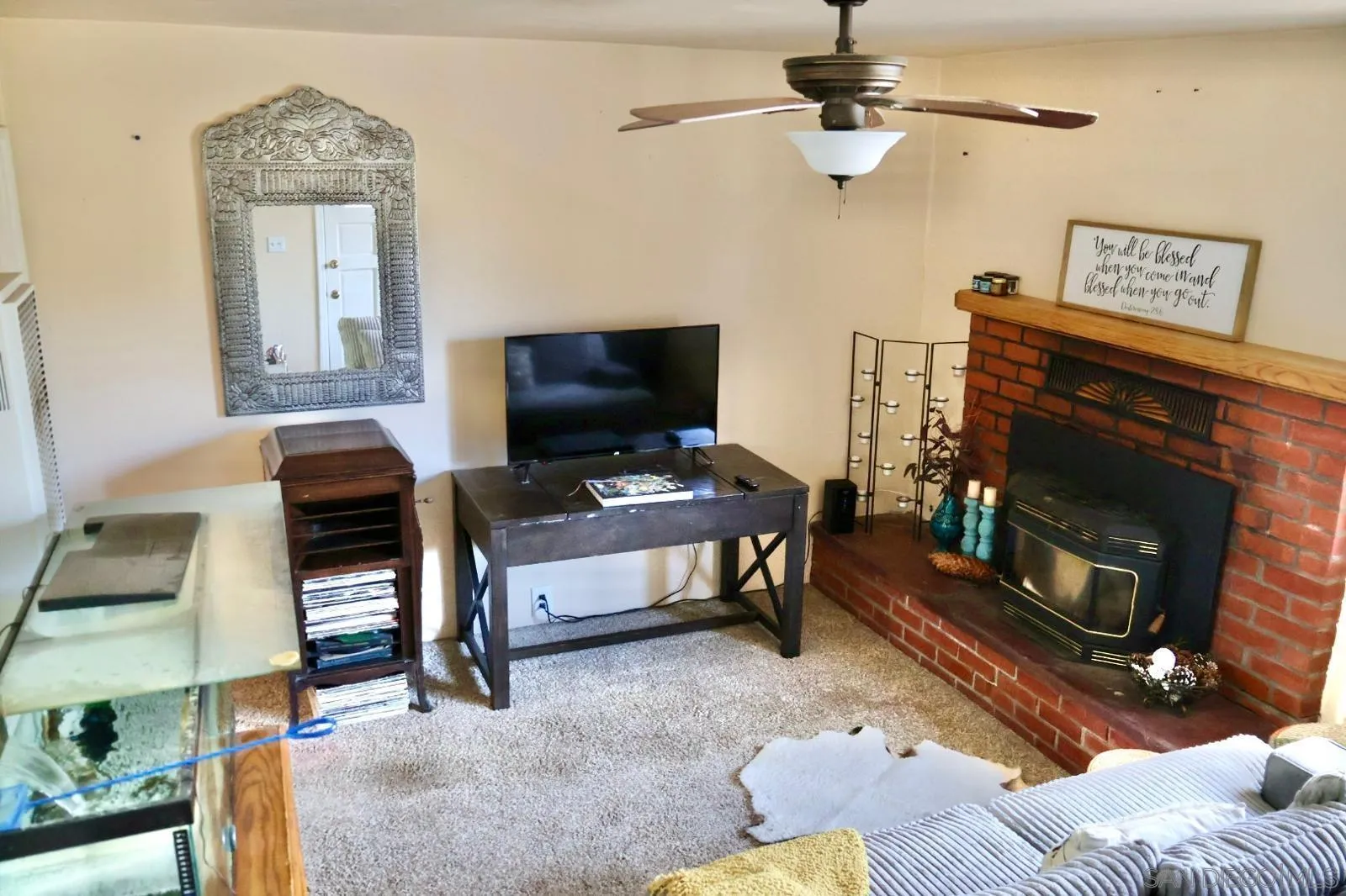 1273 Ridge Trail Julian, CA 92036 - Photo 9 of 33 a living room with furniture a flat screen tv and a fireplace