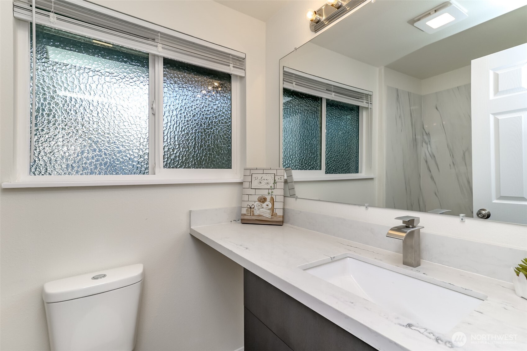2727 South 357th Place Federal Way, WA 98003 - Photo 12 of 24 a bathroom with a sink a toilet and mirror