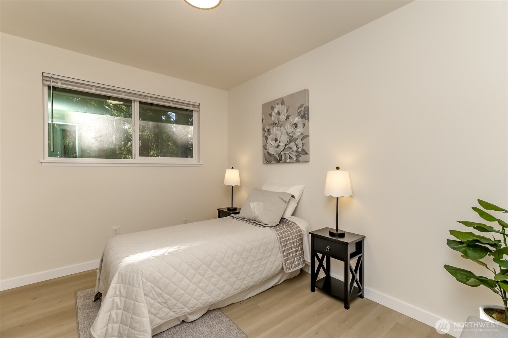 2727 South 357th Place Federal Way, WA 98003 - Photo 14 of 24 a bedroom with a bed and a lamp on table