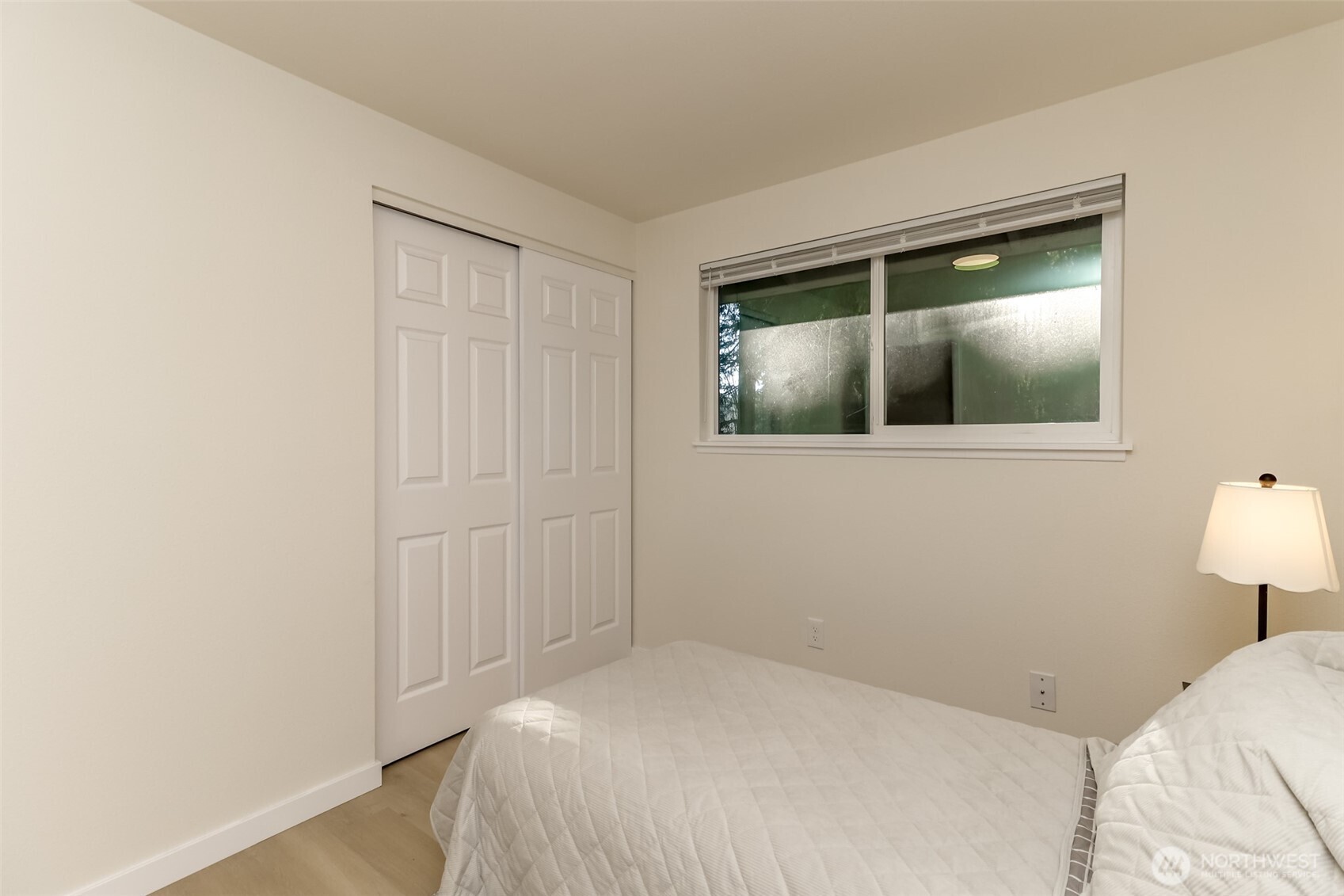 2727 South 357th Place Federal Way, WA 98003 - Photo 15 of 24 a bedroom with a bed and a lamp on table