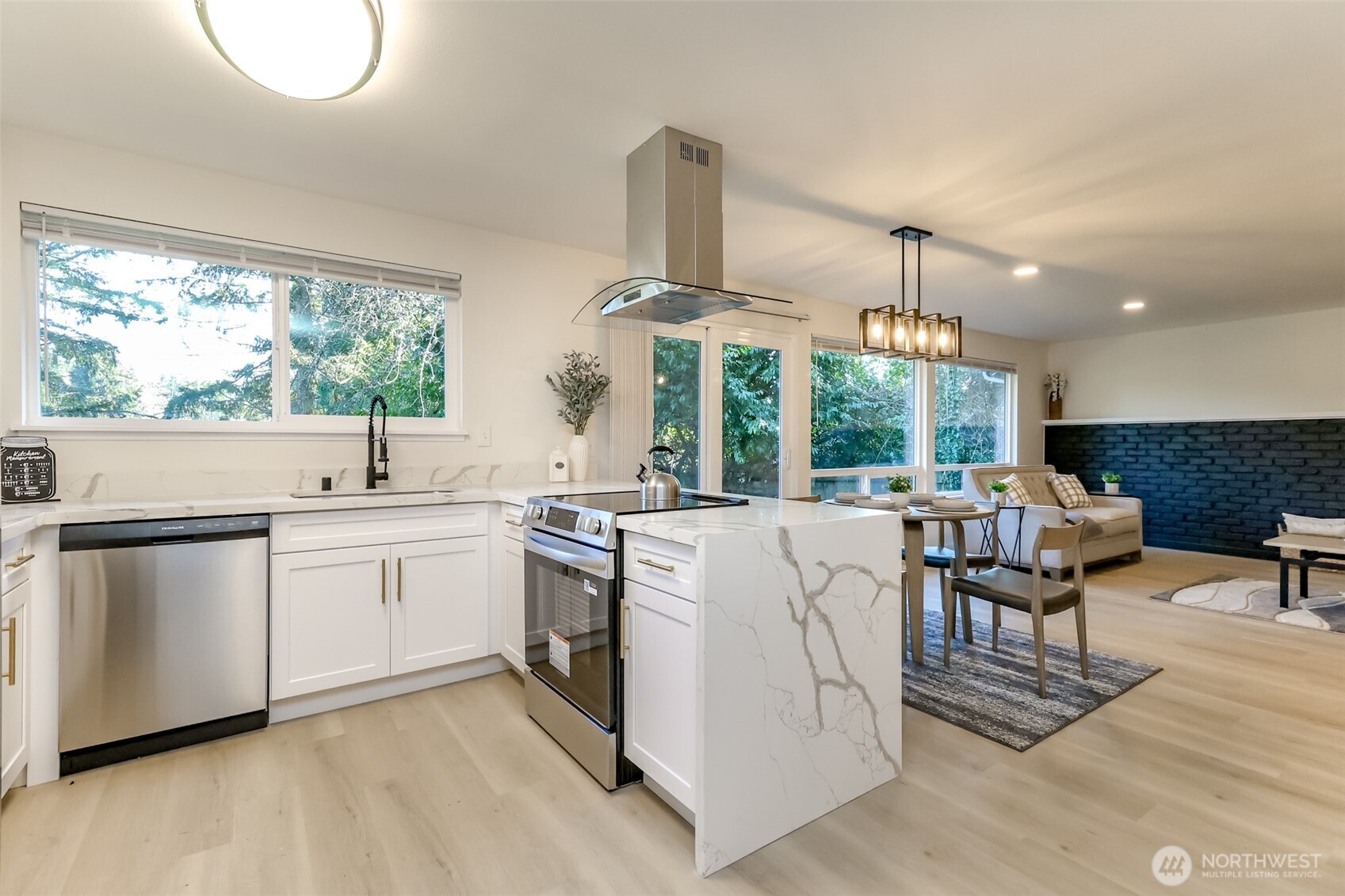 2727 South 357th Place Federal Way, WA 98003 - Photo 6 of 24 a kitchen with center island and stainless steel appliances