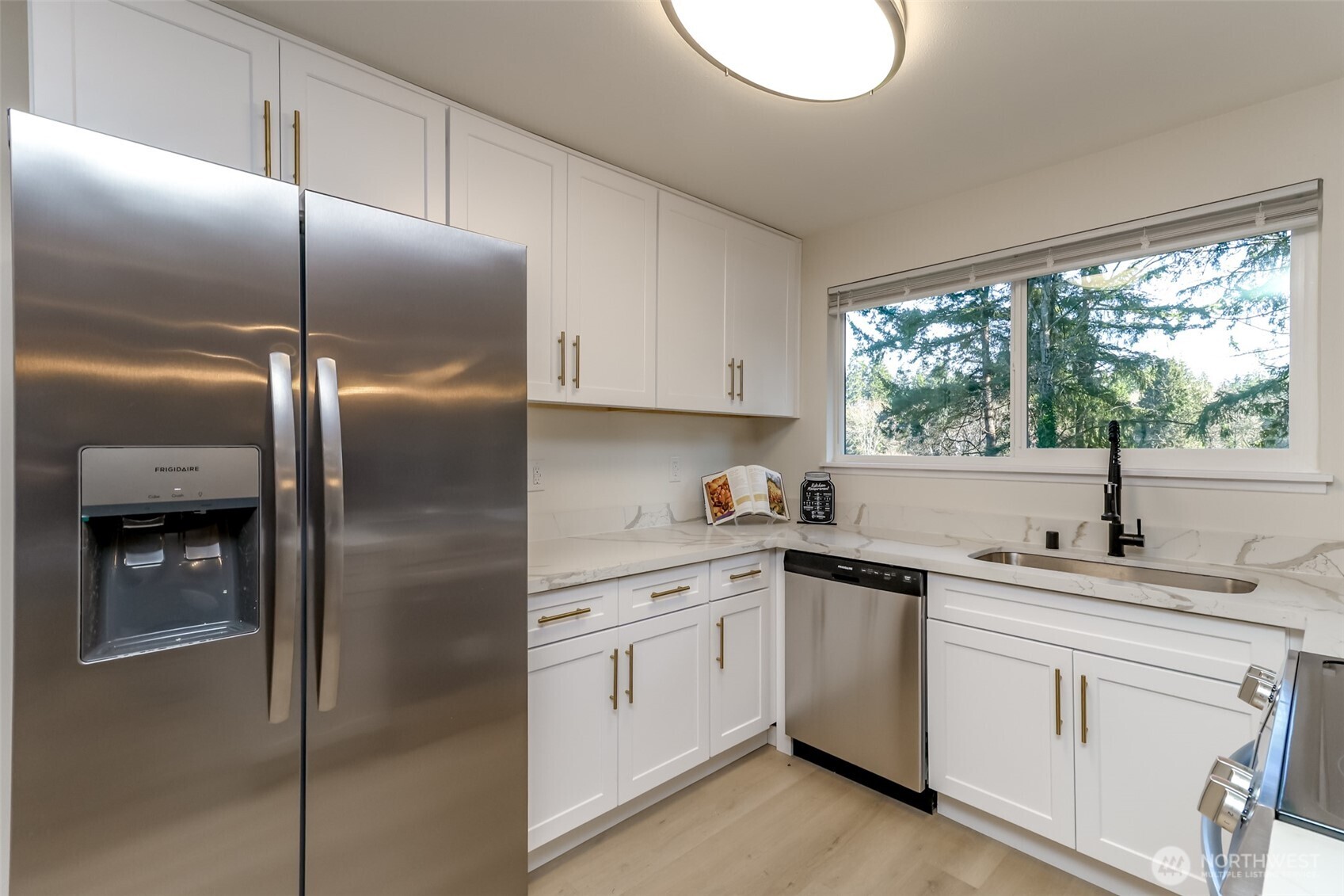 2727 South 357th Place Federal Way, WA 98003 - Photo 7 of 24 a kitchen with a refrigerator sink and cabinets