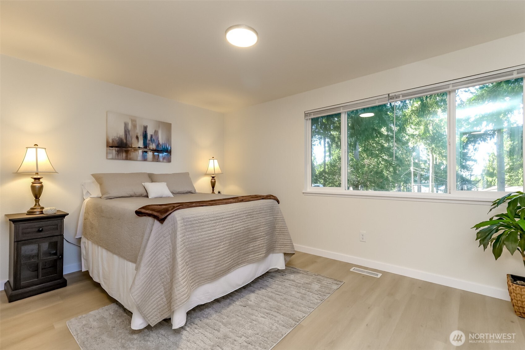 2727 South 357th Place Federal Way, WA 98003 - Photo 9 of 24 a bedroom with a bed and a potted plant