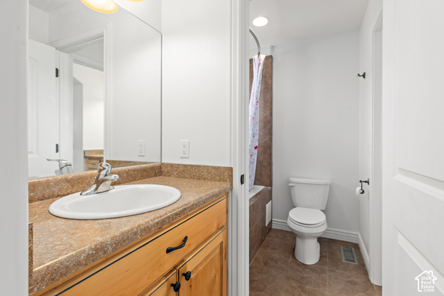 2092 Cres Drive South Mapleton, UT 84664 - Photo 16 of 26 Bathroom featuring a light wood-finish vanity with dark hardware, a spacious countertop with an integrated sink, and an overhead light fixture