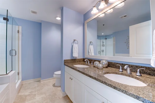 a view of a room with a table and chairs