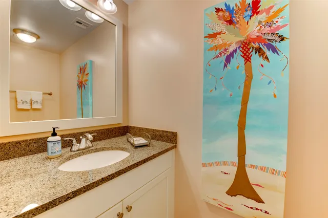 a bedroom with a bed and a book shelf