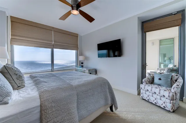 a bedroom with a bed and a tv