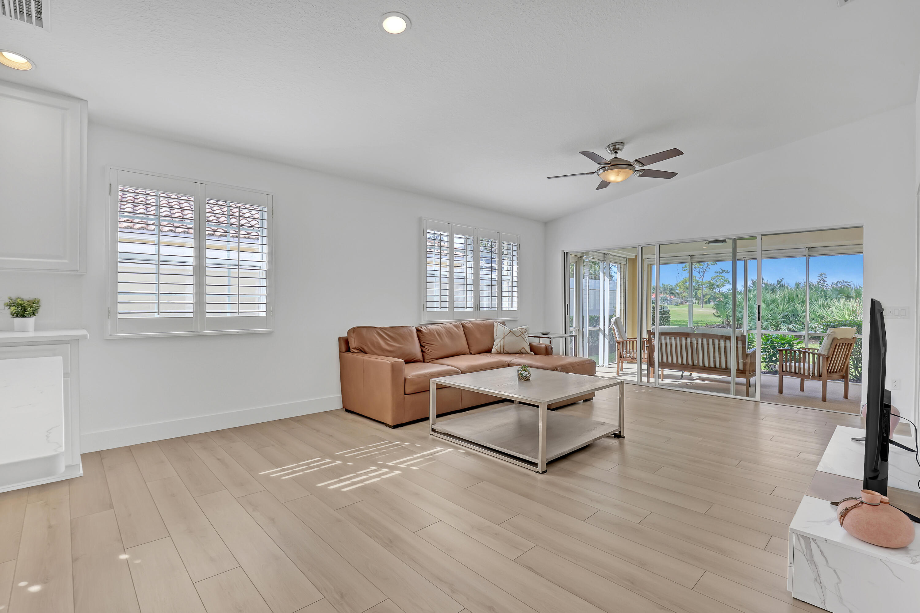 907 Southwest Balmoral Trace Stuart, FL 34997 - Photo 15 of 46 a living room with furniture and a large window