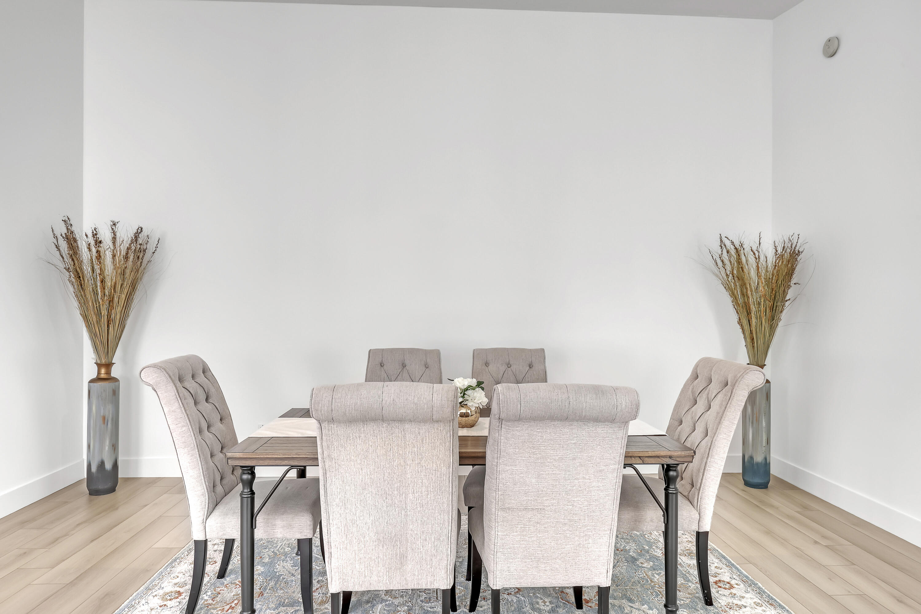 907 Southwest Balmoral Trace Stuart, FL 34997 - Photo 17 of 46 a view of a dining room with furniture and wooden floor