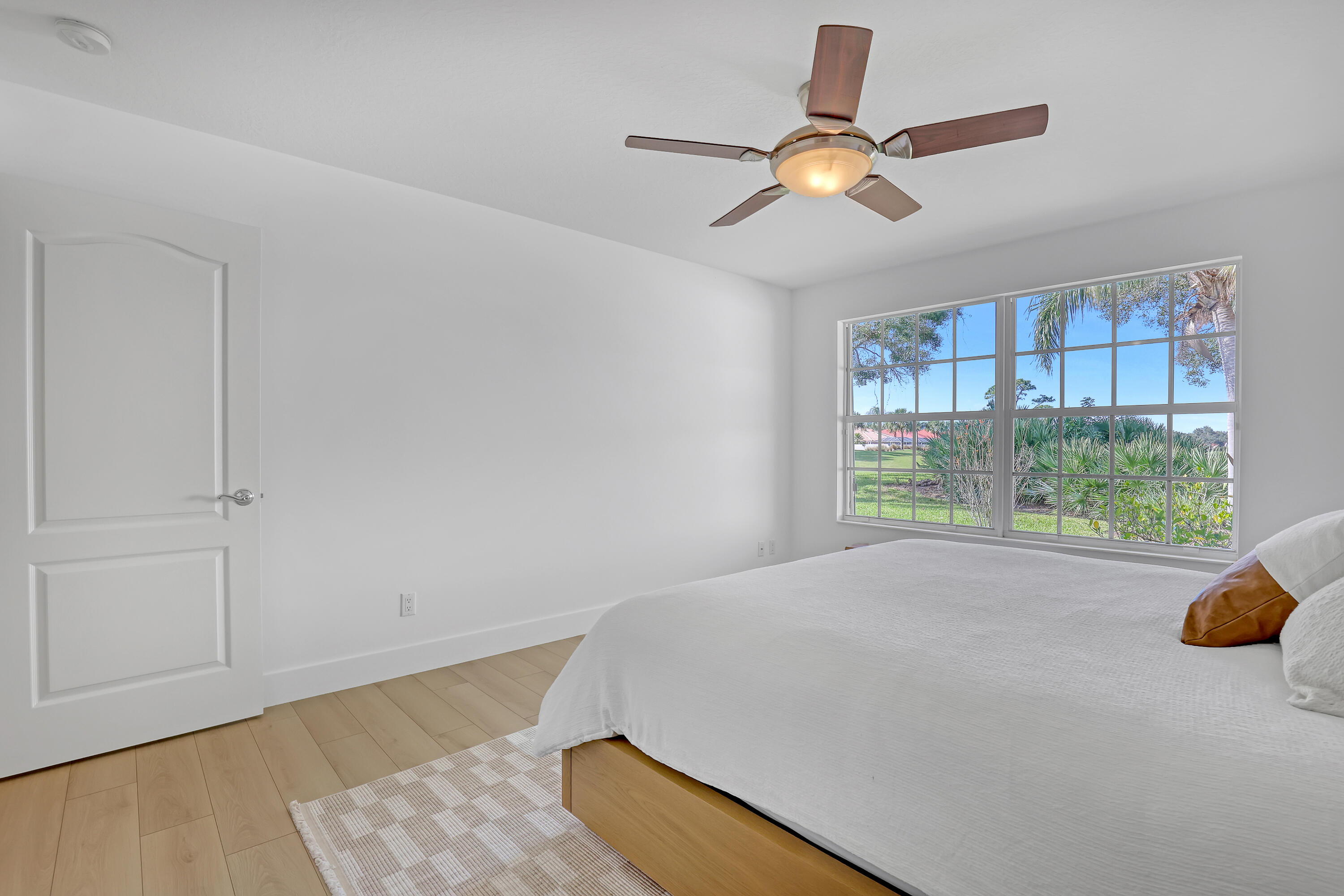 907 Southwest Balmoral Trace Stuart, FL 34997 - Photo 20 of 46 a bed room with a bed and a window