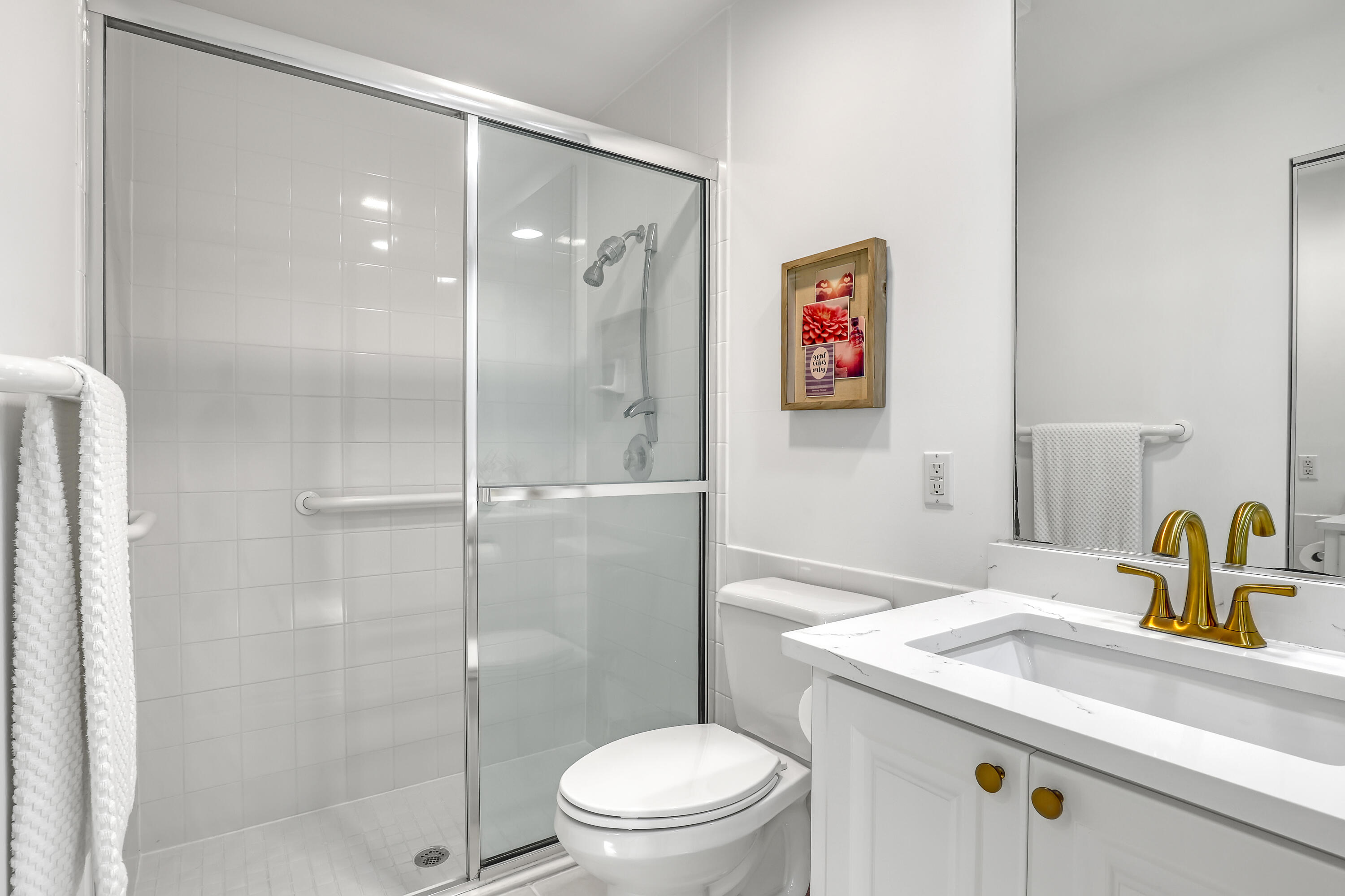 907 Southwest Balmoral Trace Stuart, FL 34997 - Photo 23 of 46 a bathroom with a sink a toilet and shower