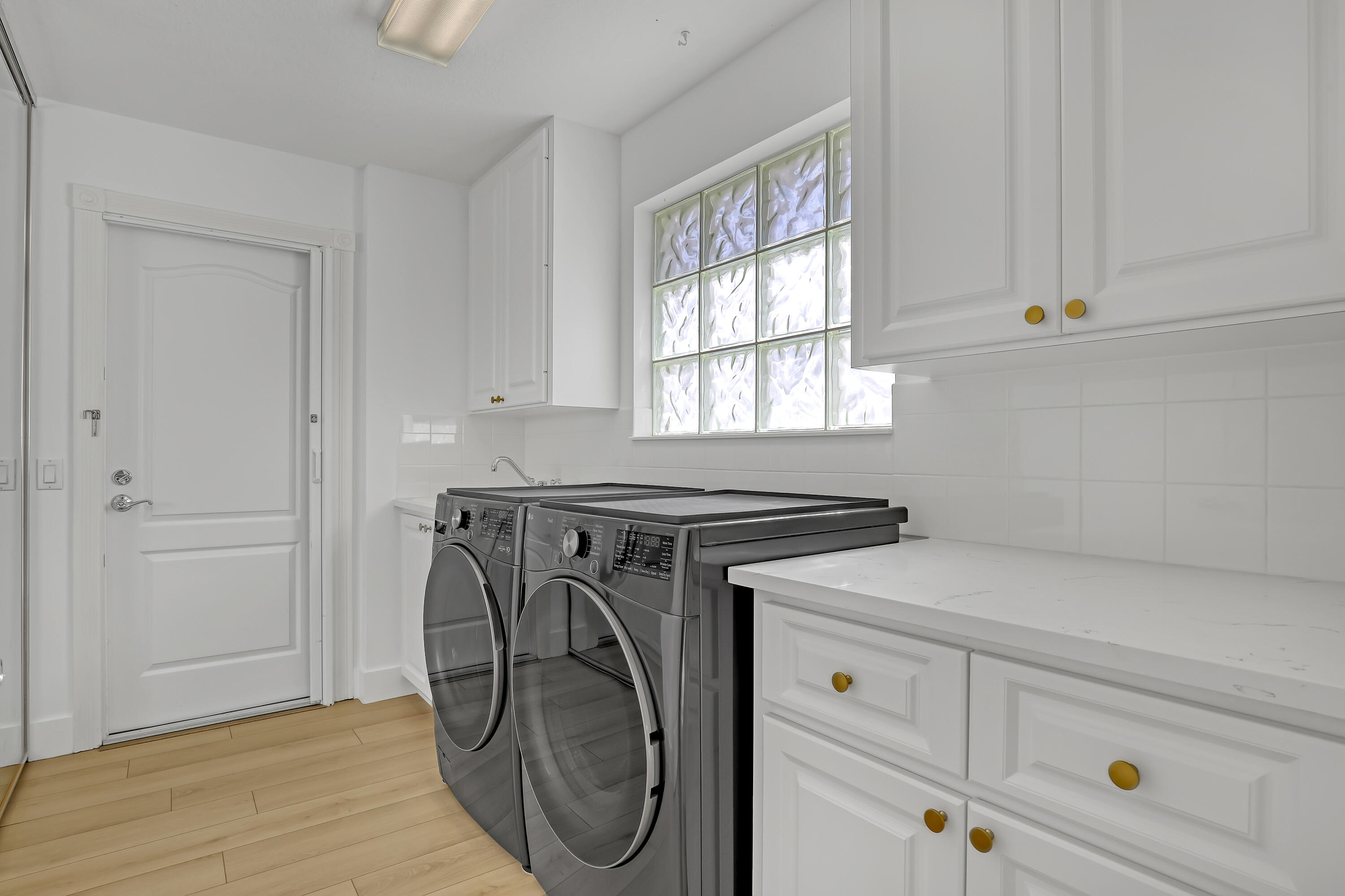 907 Southwest Balmoral Trace Stuart, FL 34997 - Photo 24 of 46 a utility room with dryer and washer