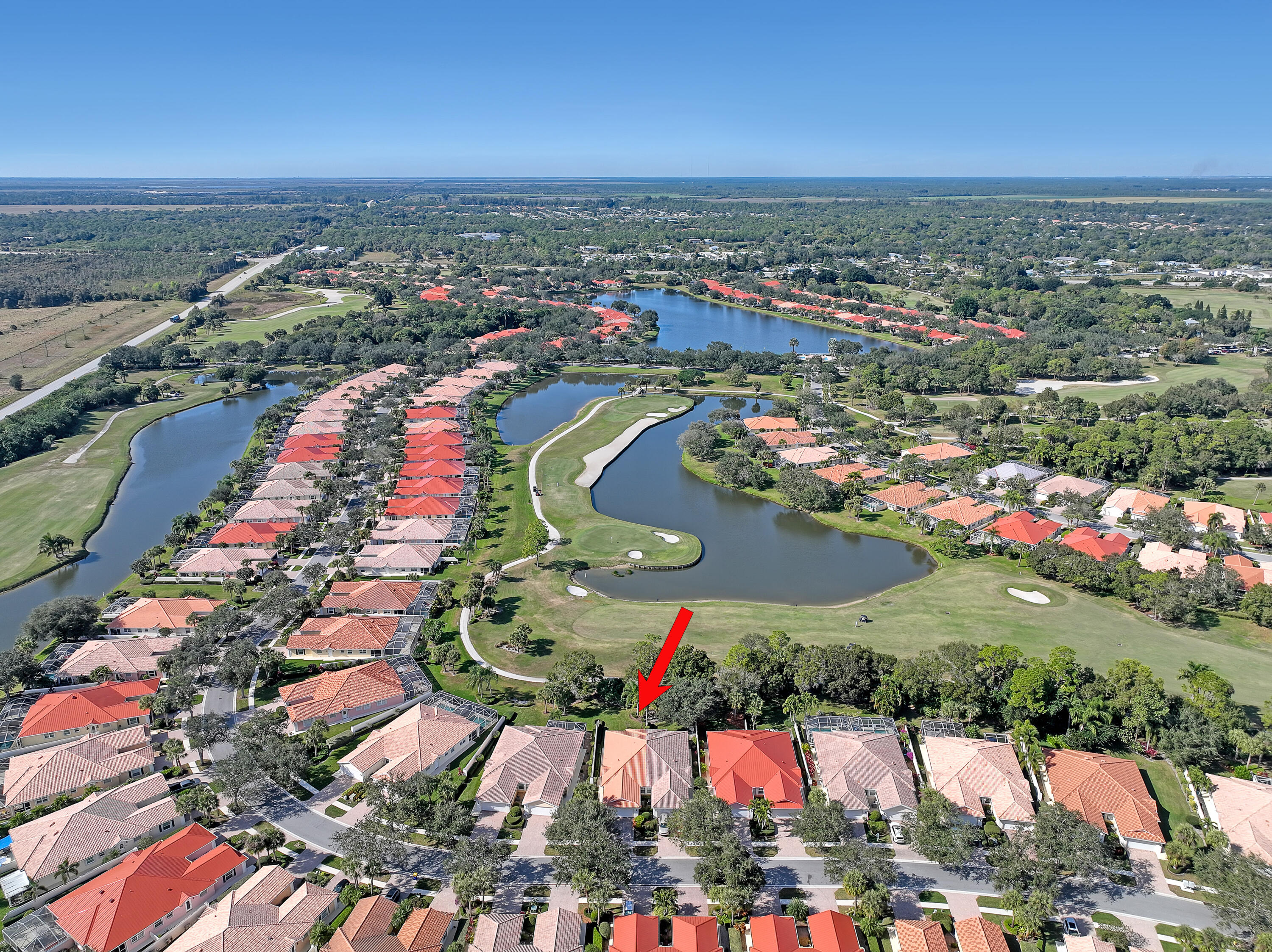 907 Southwest Balmoral Trace Stuart, FL 34997 - Photo 35 of 46 an aerial view of residential houses with outdoor space and ocean view