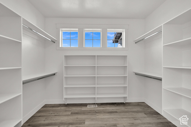 658 West 500 South Logan, UT 84321 - Photo 4 of 25 Walk in closet with light wood-style floors