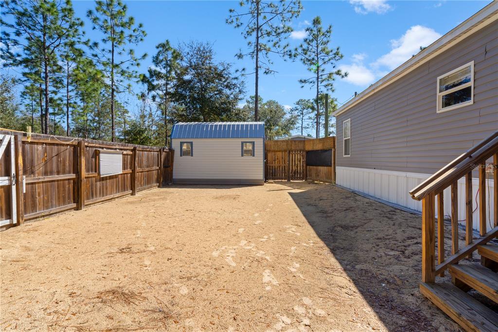 10811 Northeast 57th Street Bronson, FL 32621 - Photo 19 of 21 a view of a backyard