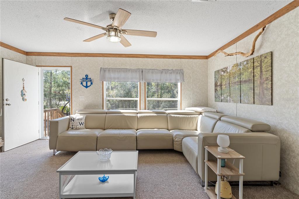 10811 Northeast 57th Street Bronson, FL 32621 - Photo 5 of 21 a living room with furniture and a window