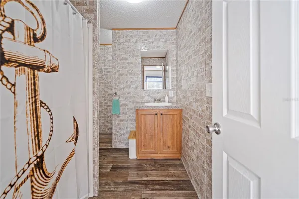 a view of a door with wooden floor and door