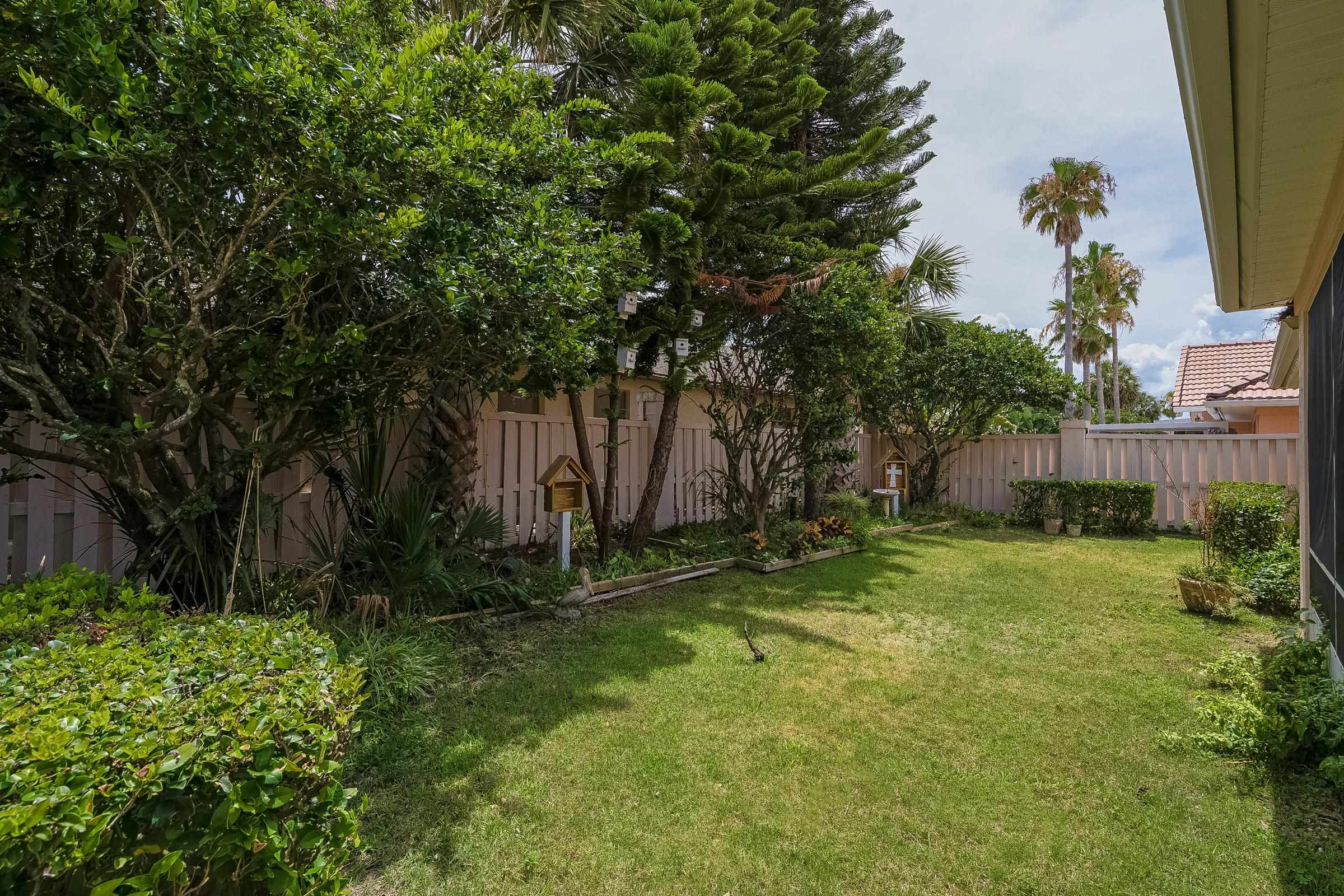 121 Tide Watch Drive St. Augustine, FL 32080 - Photo 14 of 49 a backyard of a house with lots of green space